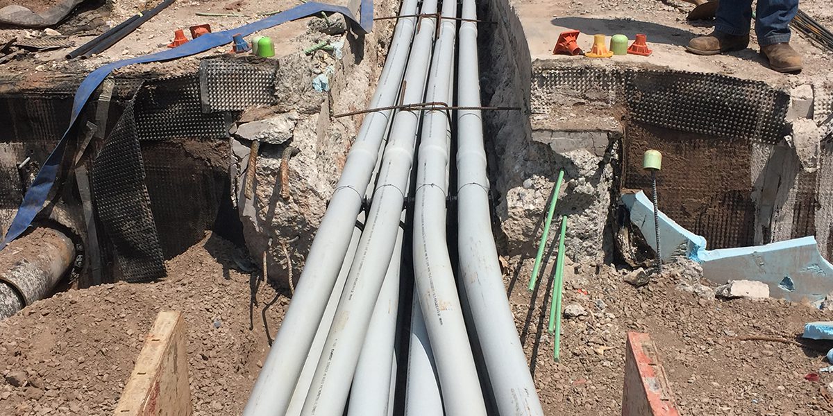 gray tubes and street construction