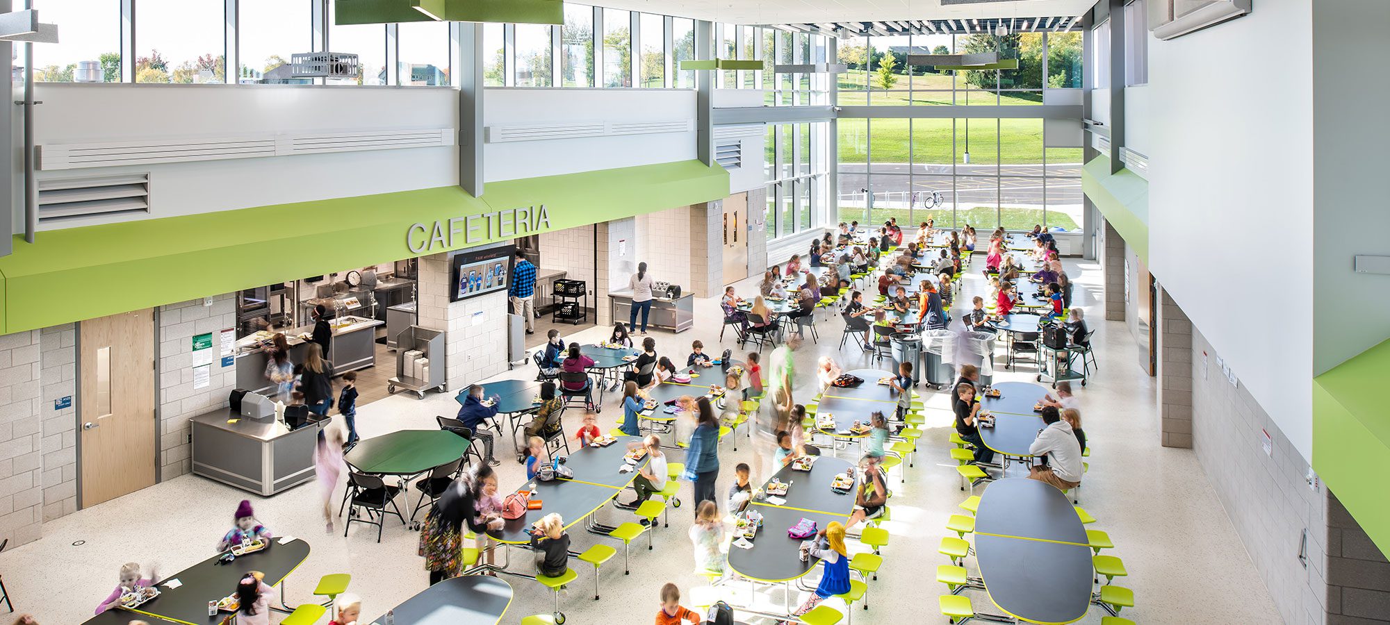 overhead view of cafeteria with students and staff eating