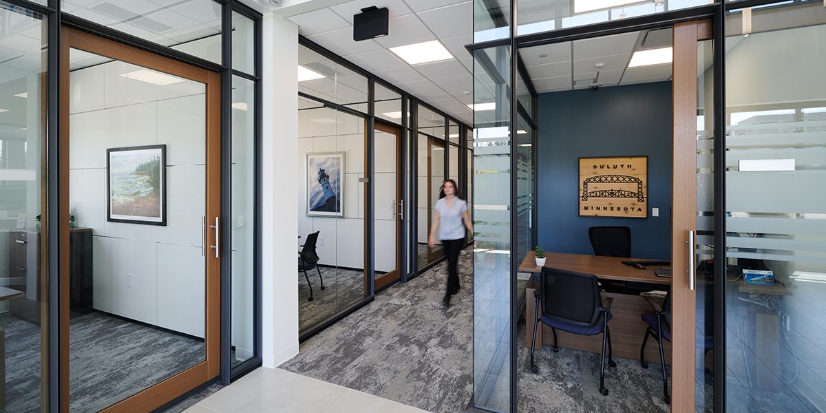 person walking down hallway